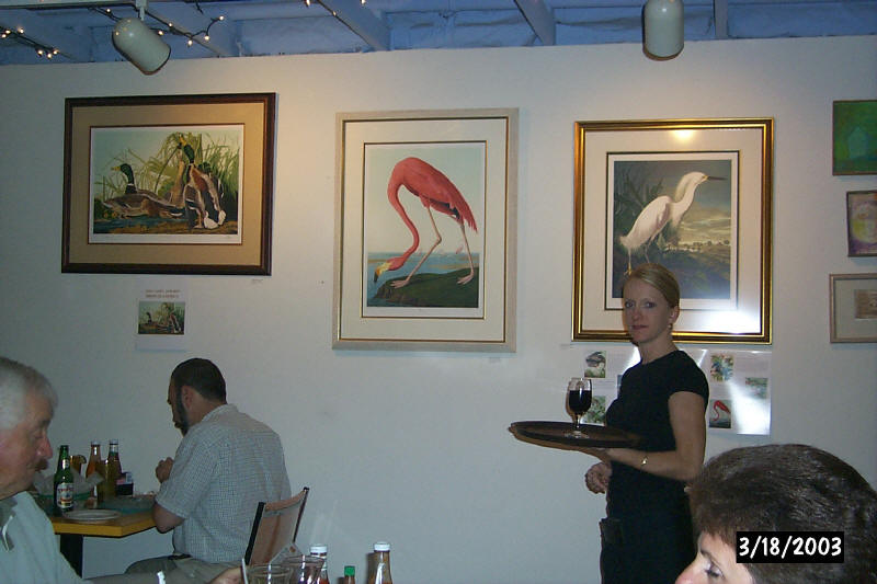A server carrying a tray through Habana Café’s dining room, 2003